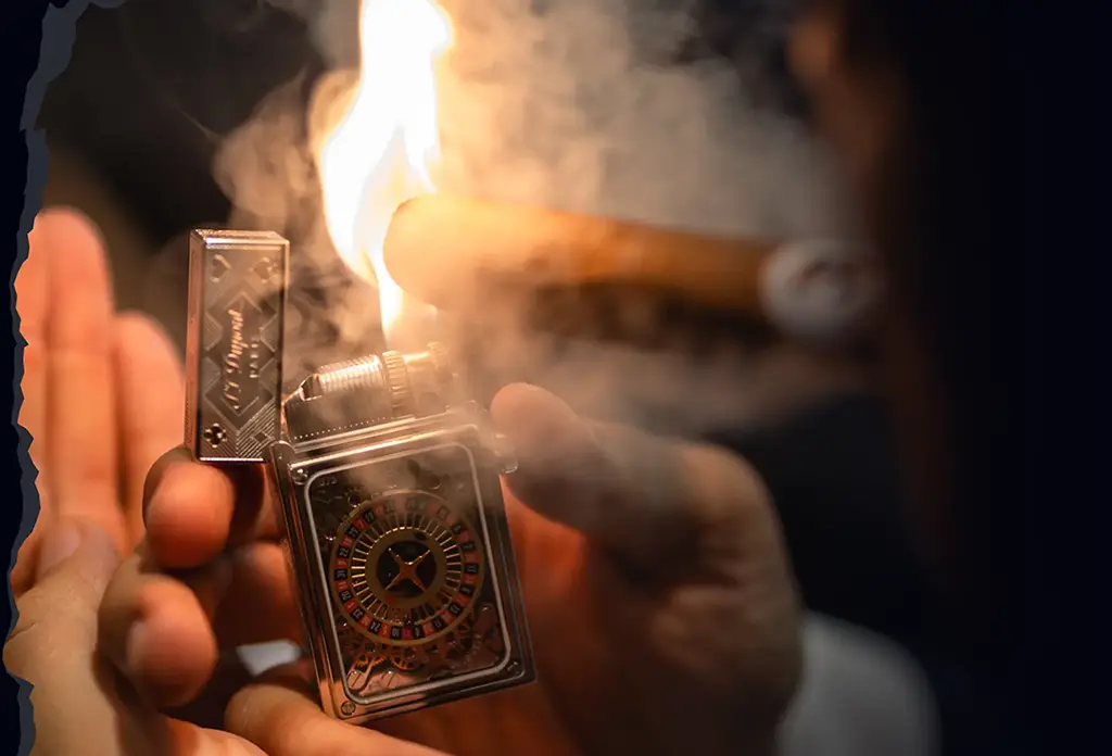 Tristan Tate lighting a cigar with the S.T. Dupont Casino Pocket Complication Lighter.